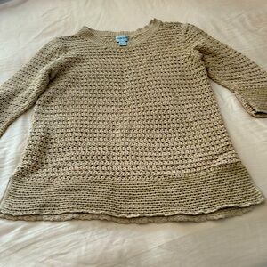 Loose weave sweater.  It’s beige wi the gold highlights in the material.